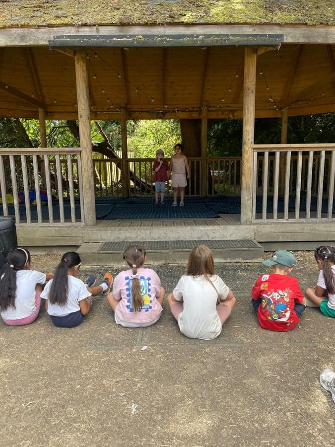 Campers sitting together in the shade for a break